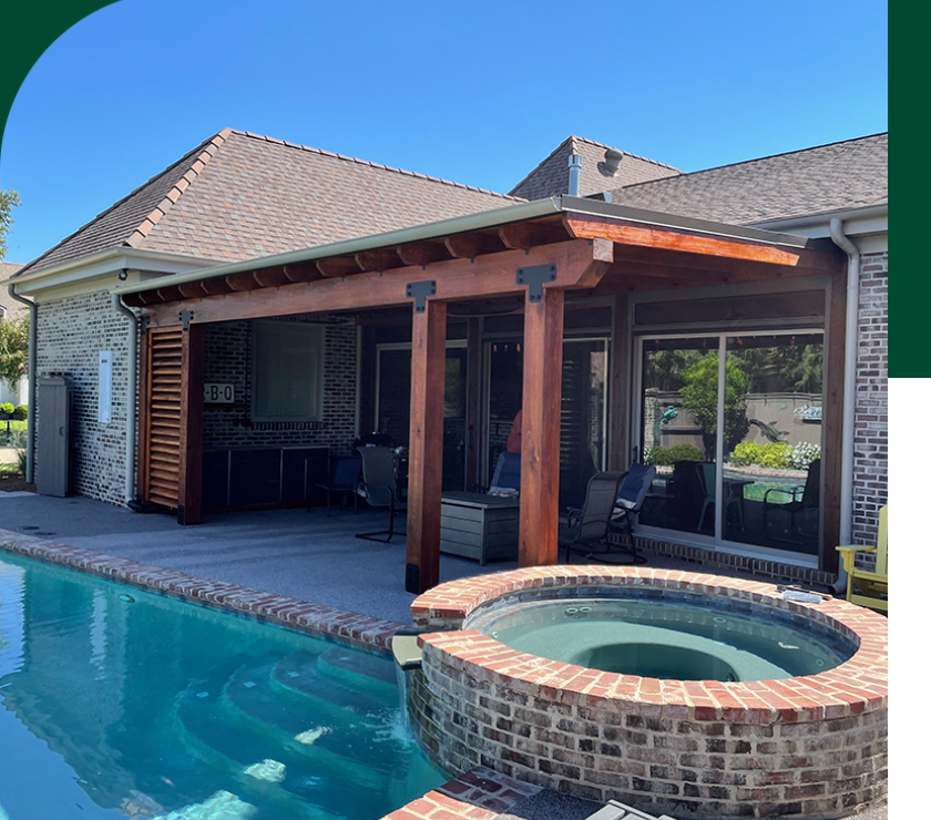 A pool with an outdoor living area and hot tub.