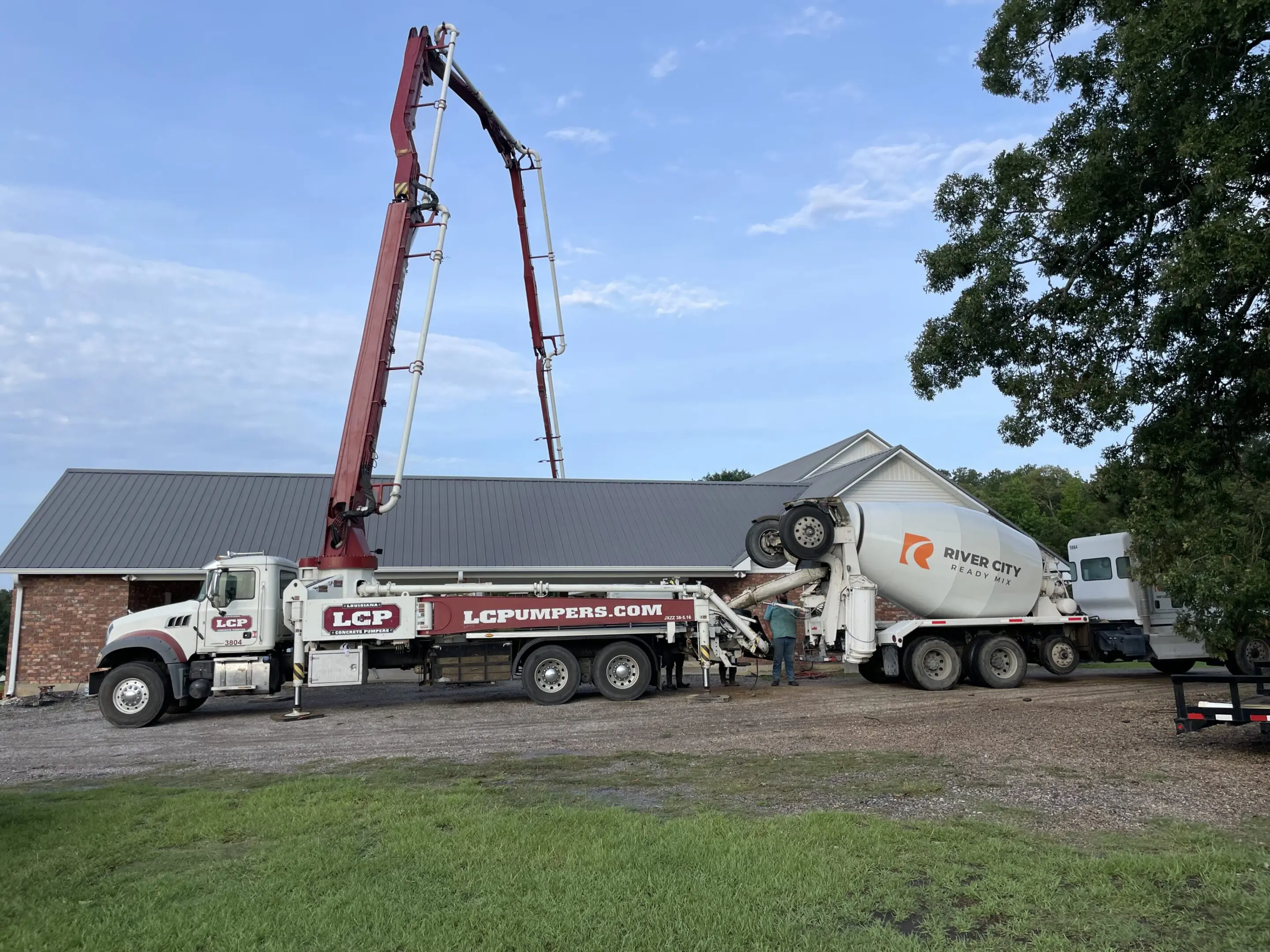 A cement truck is being loaded with concrete.