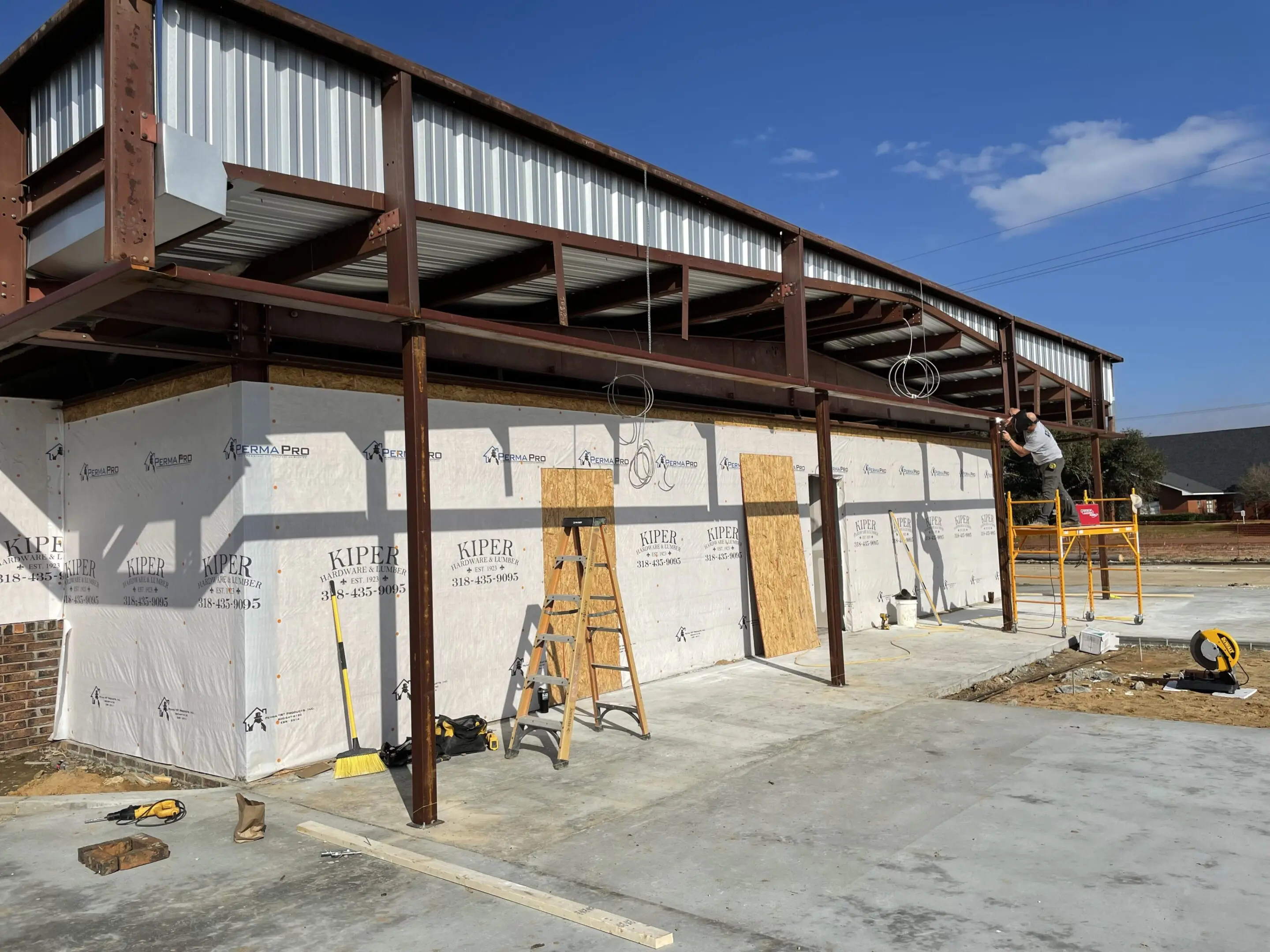 A building under construction with scaffolding around it.