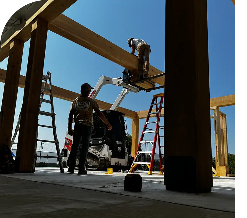 A group of people working on a building.